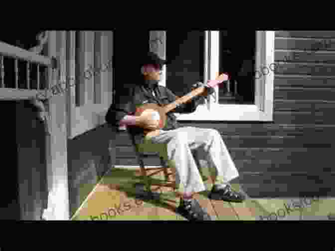 A Banjo Player Sits On A Porch, Strumming His Banjo And Lost In Music, Surrounded By Lush Greenery The Life I Ve Picked: A Banjo Player S Nitty Gritty Journey