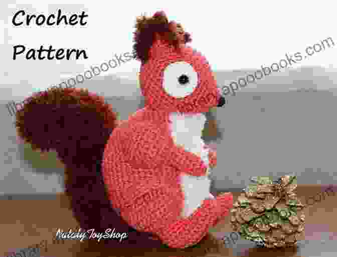 A Close Up Image Of A Crocheted Squirrel Applique With Intricate Details And A Fluffy Tail Crochet Pattern: Squirrel Applique Homeartist Design