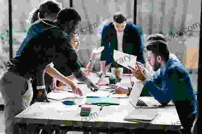 A Group Of People Working On A Large Whiteboard, Symbolizing Organizational Transformation The Power Of Polarities: An Innovative Method To Transform Individuals Teams And Organizations Based On Carl Jung S Theory Of The Personality