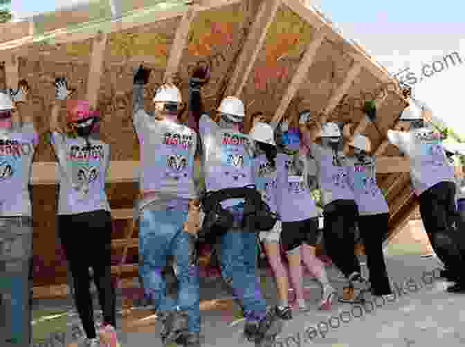 A Group Of Volunteers Working Together To Build A House For A Family In Need. The Good Glow: Charity And The Symbolic Power Of ng Good