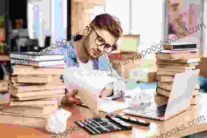 A Writer Sitting At A Desk, Pensively Gazing At A Sheet Of Paper, Surrounded By Scattered Notes And Storyboards. Writing Short Films: Structure And Content For Screenwriters